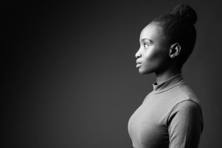 Young beautiful African Zulu woman against gray backgroundの写真素材