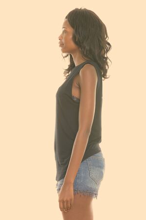 Profile view of young black African woman standing from Botswanaの写真素材