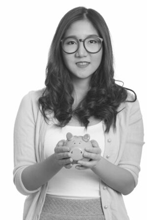 Portrait of young beautiful Asian woman in black and whiteの写真素材