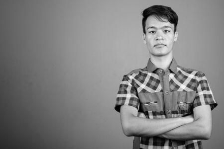 Portrait of young handsome Asian teenage boyの写真素材