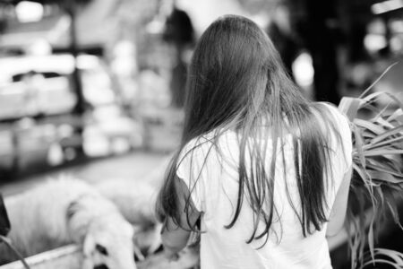 Portrait of young beautiful tourist woman having vacation in Thailand in black and whiteの写真素材