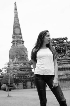 Portrait of young beautiful tourist woman having vacationの写真素材