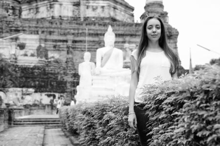 Portrait of young beautiful tourist woman having vacationの写真素材
