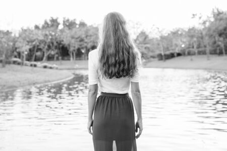 Portrait of beautiful woman relaxing at the parkの写真素材