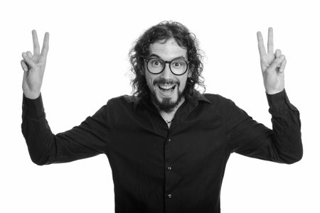 Happy handsome Caucasian man giving peace sign with both hands