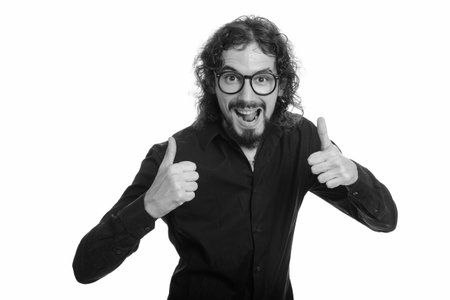 Happy handsome Caucasian man giving thumbs up