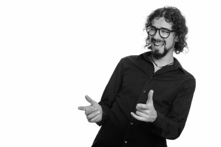 Happy Caucasian man laughing and pointing both fingersの写真素材