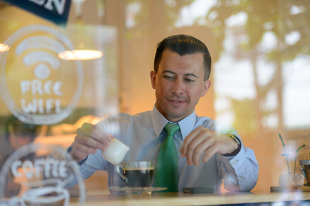 Young handsome businessman at the coffee shop