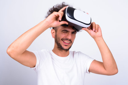 Portrait of happy bearded Turkish man with virtual reality headset