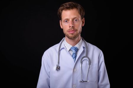 Portrait of bearded man doctor looking at cameraの写真素材