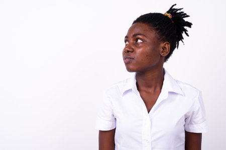 Portrait of young beautiful African woman as student