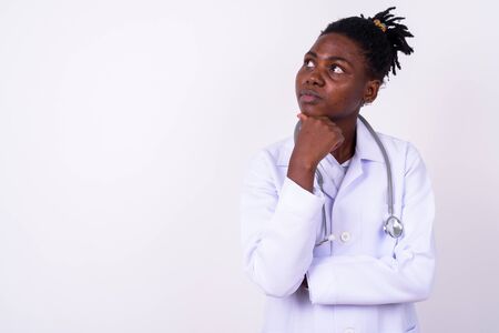 Portrait of young beautiful African woman doctorの写真素材