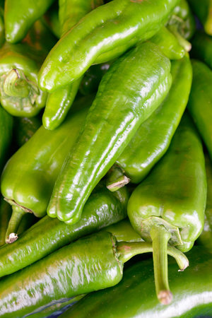 Portrait of green bell peppers outdoors in market