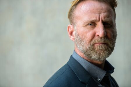 Face of mature handsome bearded businessman in suitの写真素材