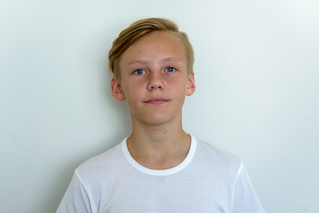 Face of young handsome boy with blond hair