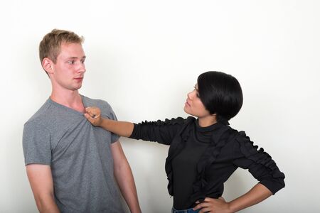 Portrait of young multi ethnic couple togetherの写真素材