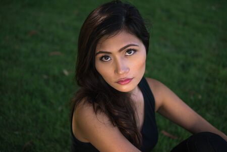 Young beautiful Asian woman at the park outdoorsの写真素材