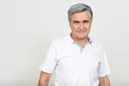 Portrait of handsome senior man looking at camera