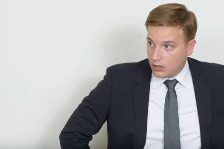 Portrait of businessman with blond hair wearing suitの写真素材