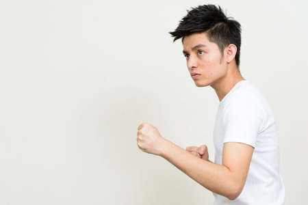 Portrait of young handsome Asian manの写真素材