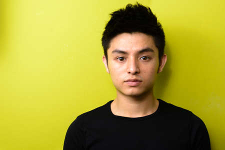 Portrait of young handsome Asian manの写真素材
