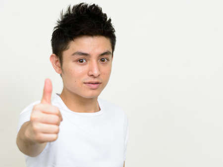 Portrait of young handsome Asian manの写真素材