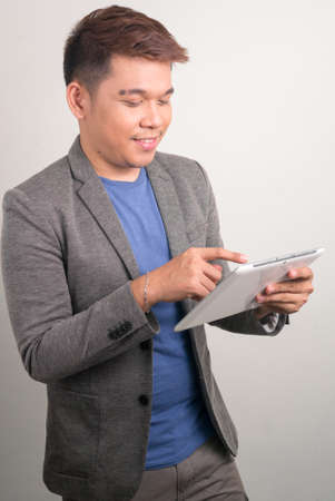 Portrait of young handsome Asian businessmanの写真素材