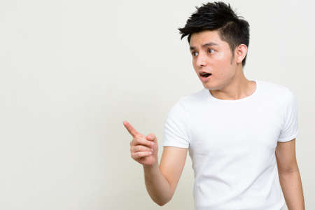Portrait of young handsome Asian manの写真素材