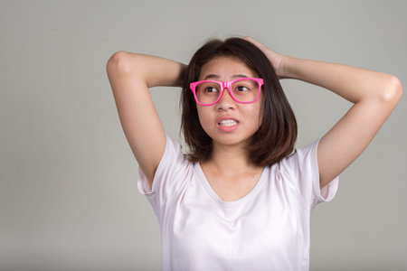 Portrait of young beautiful Asian teenage girl with short hair