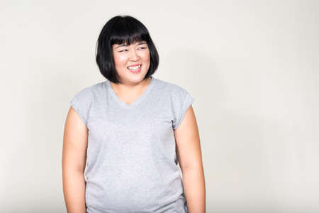 Portrait of young beautiful overweight Asian womanの写真素材