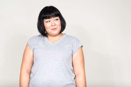 Portrait of young beautiful overweight Asian womanの写真素材