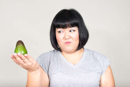 Portrait of young beautiful overweight Asian womanの写真素材