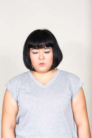 Portrait of young beautiful overweight Asian womanの写真素材