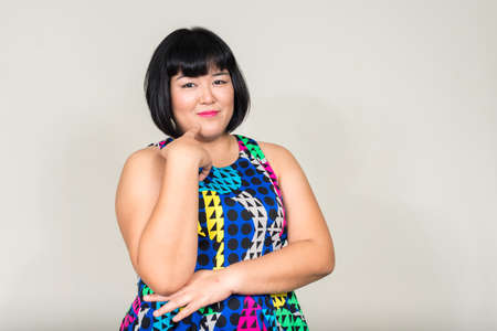 Portrait of young beautiful overweight Asian womanの写真素材