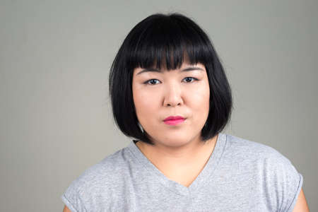 Portrait of young beautiful overweight Asian womanの写真素材
