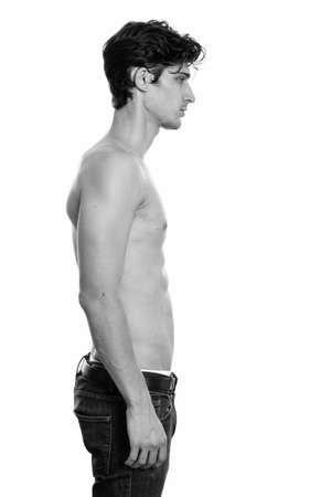 Profile view of young handsome man shirtlessの写真素材