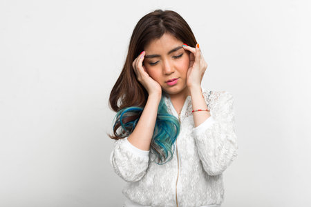 Portrait of young beautiful Asian woman with dyed hair
