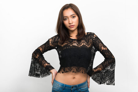 Studio shot of young beautiful Asian woman