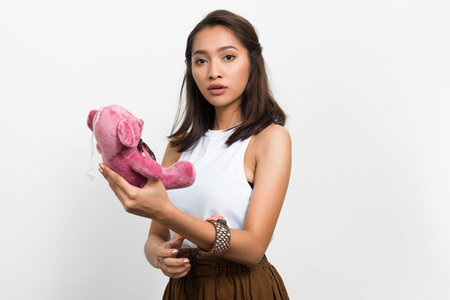 Studio shot of young beautiful Asian woman
