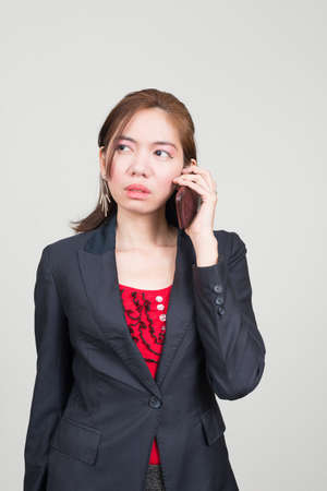 Portrait of Asian businesswoman against white backgroundの写真素材