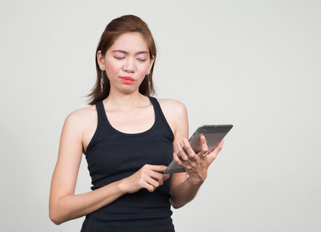 Portrait of Asian woman against white background