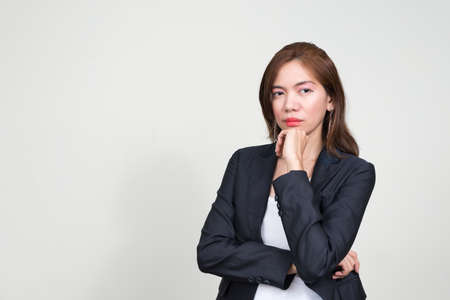 Portrait of Asian businesswoman against white backgroundの写真素材