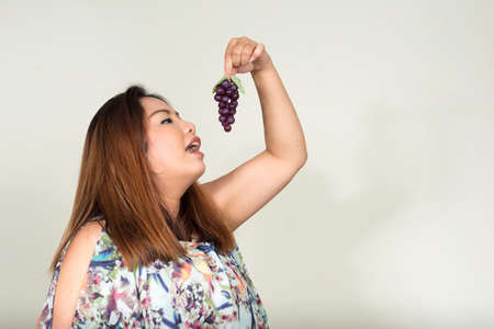 Portrait of young beautiful overweight Asian womanの写真素材