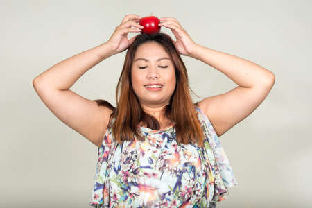 Portrait of young beautiful overweight Asian womanの写真素材