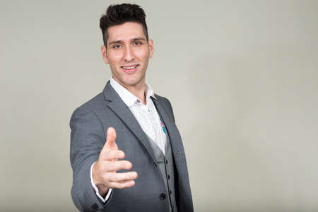 Portrait of young multi ethnic businessman in suitの写真素材