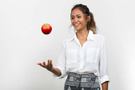Happy young beautiful Asian businesswoman with brown hairの写真素材