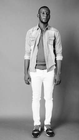 Portrait of young handsome bearded African man in casual clothingの写真素材