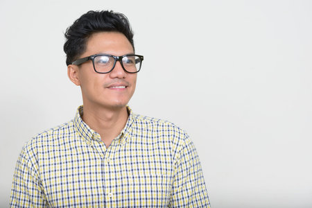 Portrait of handsome Asian hipster man with eyeglasses