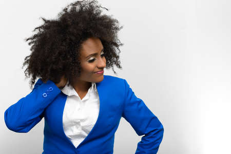 Portrait of young beautiful African businesswoman with Afro hairの写真素材