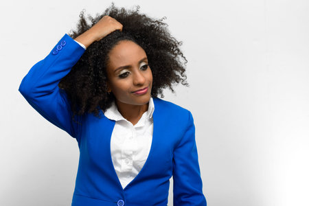 Portrait of young beautiful African businesswoman with Afro hair